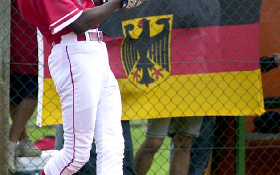 Ramstein&#39;s Andre Porterfield connects for a hit against Saudi Arabia pitcher Alex Robinett.