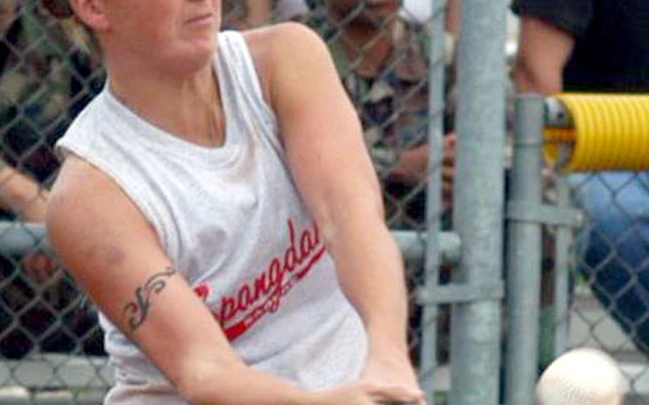 Spangdahlem shortstop Kim Bach connects with a pitch Tuesday in the first game of the championship round of the USAFE softball tournament. Spangdahlem forced a final game, but lost to Aviano 8-1.