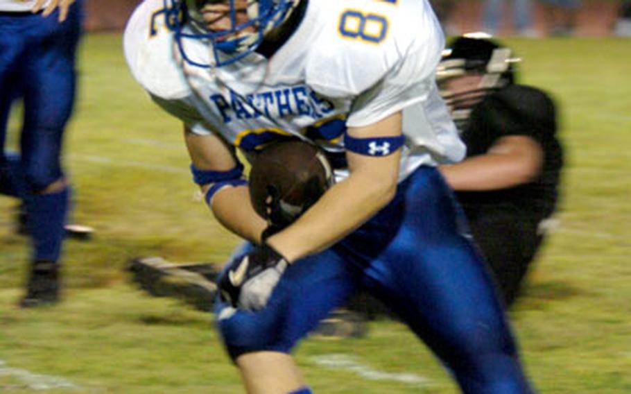 Yokota’s Justin Hudson steps across the touchdown line for the evening’s second touchdown.