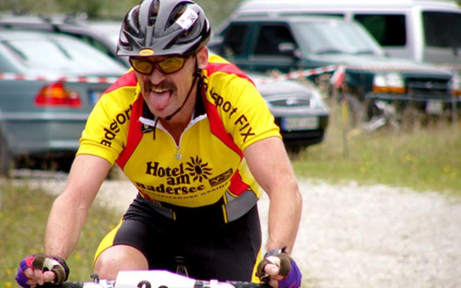 Leigh Plowman of Garmsich, Germany, kicks it home Saturday after completing a 20-kilometer ride through the woods during the Fat Tire Spectacular in Garmisch.