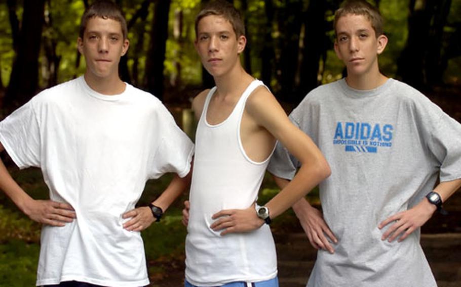 From left, Matt, Tim and Brandon Spicer. The sophomore triplets run for Mannheim High School’s cross country team, and all three have finished in the top 10 in both of the Bison’s meets this season.