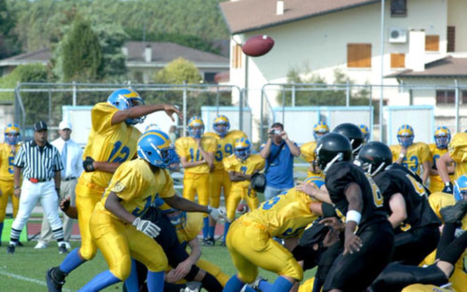 Ansbach quarterback John Willis gets off his first pass of the day against Vicenza — a short pass that Tyler Sherman turned into a 53-yard touchdown to make the score 16-0 midway through the first quarter. Ansbach won 68-0 to break the DODDS-Europe record for consecutive victories with 27.