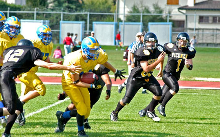 Running back Charles Melton, who spent a lot of time Saturday taking snaps as Ansbach’s backup quarterback, breaks through the Vicenza defense for a big gain.