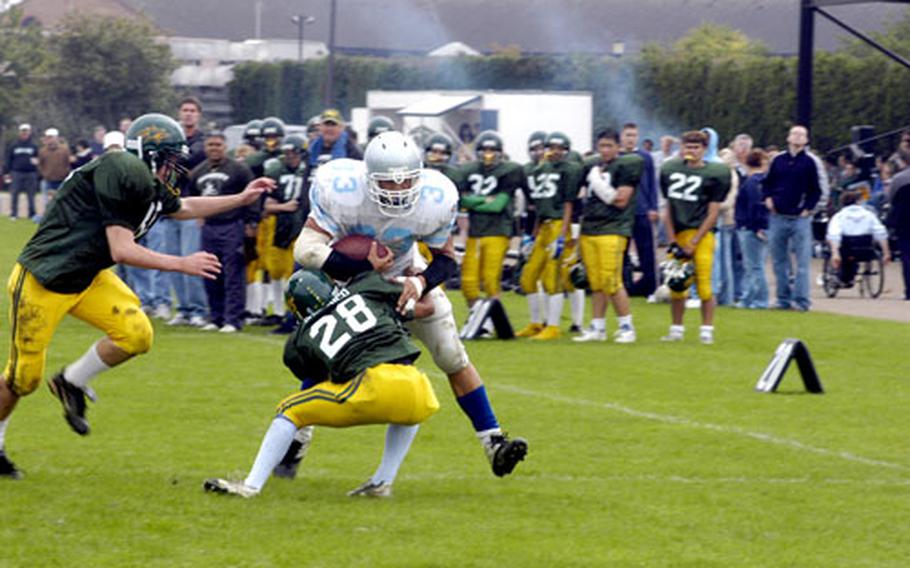 Alconbury’s Dominick Sherenco hits Brussels ball carrier Eric Popp in the first half.
