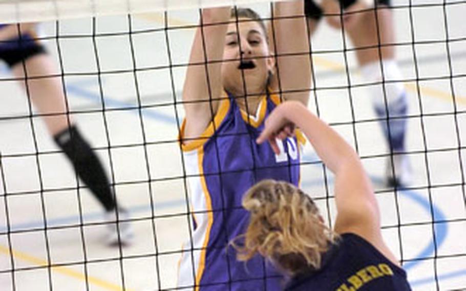 Heidelberg’s Julia Roberson spikes the ball past Würzburg&#39;s Allison McKearn during a DODDS high school volleyball match in Wiesbaden Germany, on Saturday. Heidelberg defeated Würzburg, 25-27, 25-17, 25-11, 25-19.