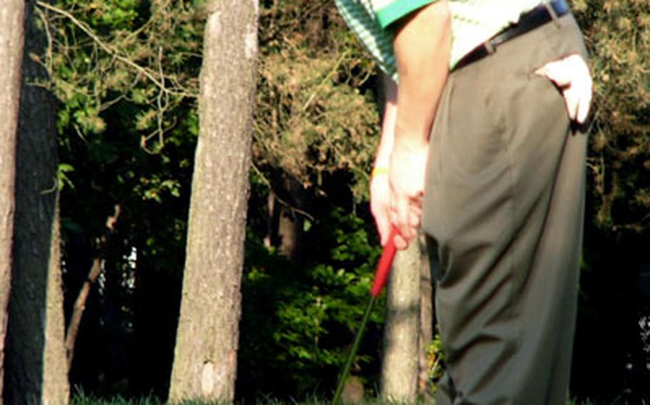 Kaiserslautern junior Ben Antonik strokes a putt Tuesday during a practice round at Ramstein Air Base&#39;s Woodlawn Golf Course.