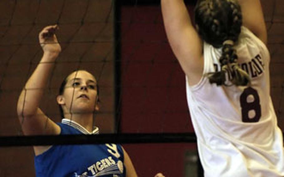 Baumholder’s Katrina Alsup, right, blocks the shot of Hohenfels’ Kirsten Arnold.