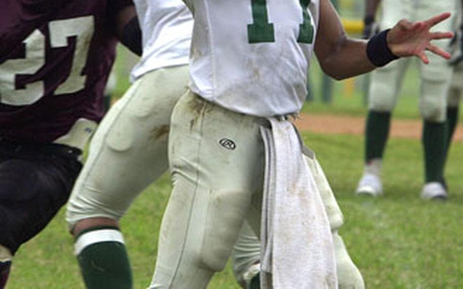 Courtney-Hansen Titans quarterback Derek Nicholas throws a pass Saturday at Camp Foster, Okinawa.