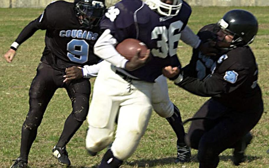 Seoul American running back Calvin Lasane (36) ran 10 times for 172 yards and three touchdowns Saturday as the Falcons captured their third straight league title.