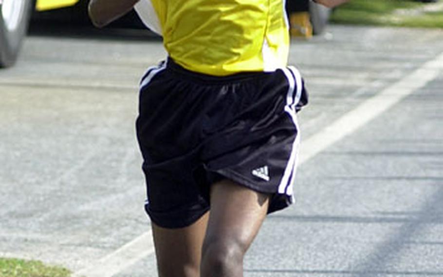 Kadena&#39;s Anthony Tillman nears the finish line of Wednesday&#39;s race. He won in 17 minutes, 22 seconds, the fastest on-island time this season and also a personal best.