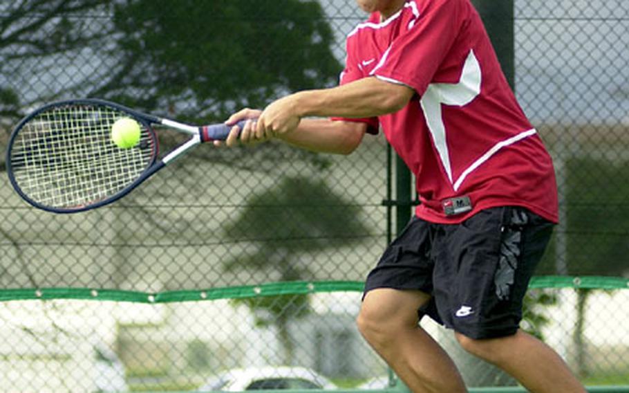 Kadena Panthers senior Anthony Soroka lunges to make a two-handed forehand shot against Bryan Garcia of the Kubasaki Dragons during Thursday&#39;s first singles match in the 2005 Okinawa Activities Council all-island tennis championships at Kadena Air Base. Soroka capped an unbeaten singles season by beating Garcia 6-1.