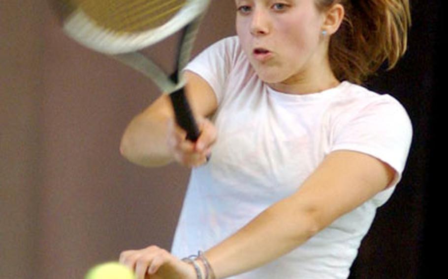 Hanau&#39;s Alix Rich returns a serve from Lakenheath&#39;s Kallie Hedberg during their consolation round match Friday afternoon.