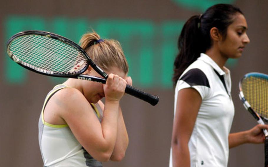 SHAPE’s Krista Citkovska, left, can&#39;t hold back her emotions after defeating Milan’s Shivani Saxena, right, 6-4, 6-4, to capture the DODDS-Europe girls’ tennis crown.