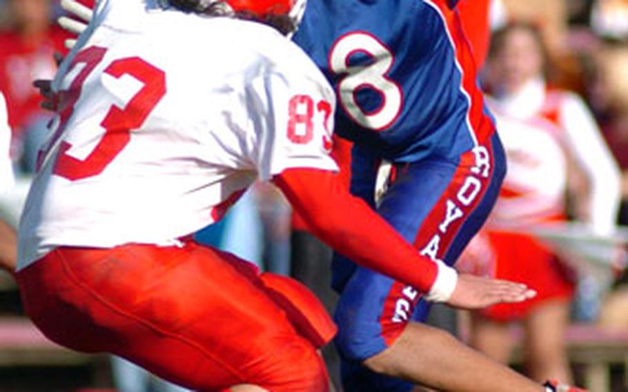 Ramstein’s Ste’phan James sidesteps the tackle of Kaiserslautern’s Julian Portillo on a long punt return.