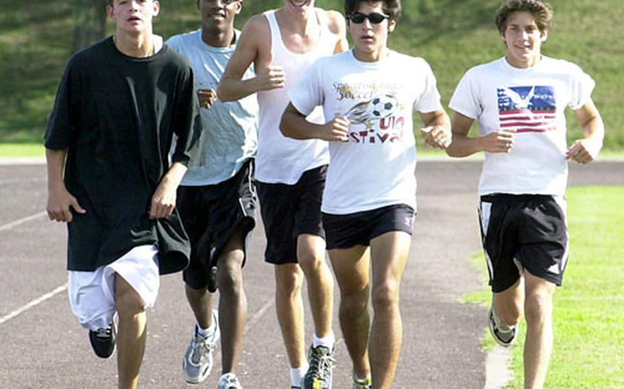 The Kadena High School cross country team, including, from left, Alex Trayer, Anthony Tillman, Tim Nabonne, Aaron Zendejas and Ben Zendejas, enters next week’s Far East meet as the two-time defending champion.