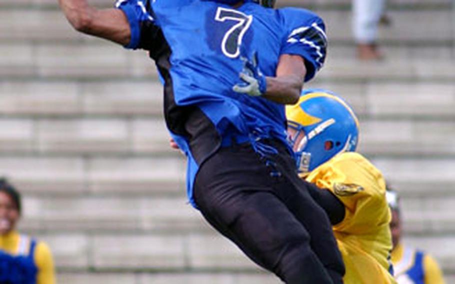 Hohenfels’ Stephen Washington can’t pull in the interception, but breaks up a pass intended for Ansbach’s Tyler Sherman in Hohenfels’ 37-20 victory over three-time defending Division III champion Ansbach.