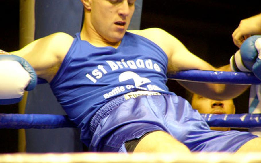 Giessen-based heavyweight Bryan Spalliero rests in his corner following his 2-1 victory over Sergei Volkov of Friedberg during Saturday’s Battle of the Battalions boxing card at Friedberg, Germany.