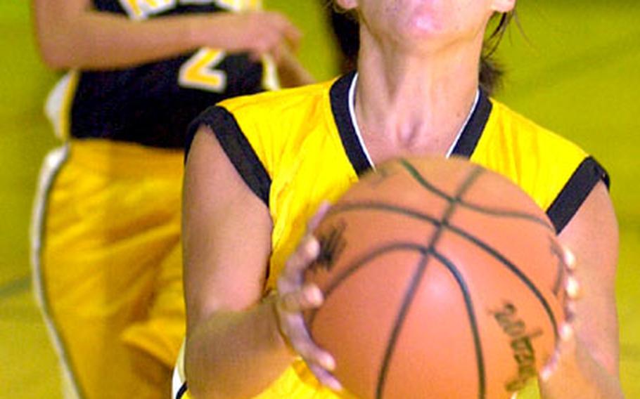 Kadena guard Dianne Abel, one of five Panthers seniors, goes up for a shot during an intrasquad scrimmage at Kadena Air Base, Okinawa.