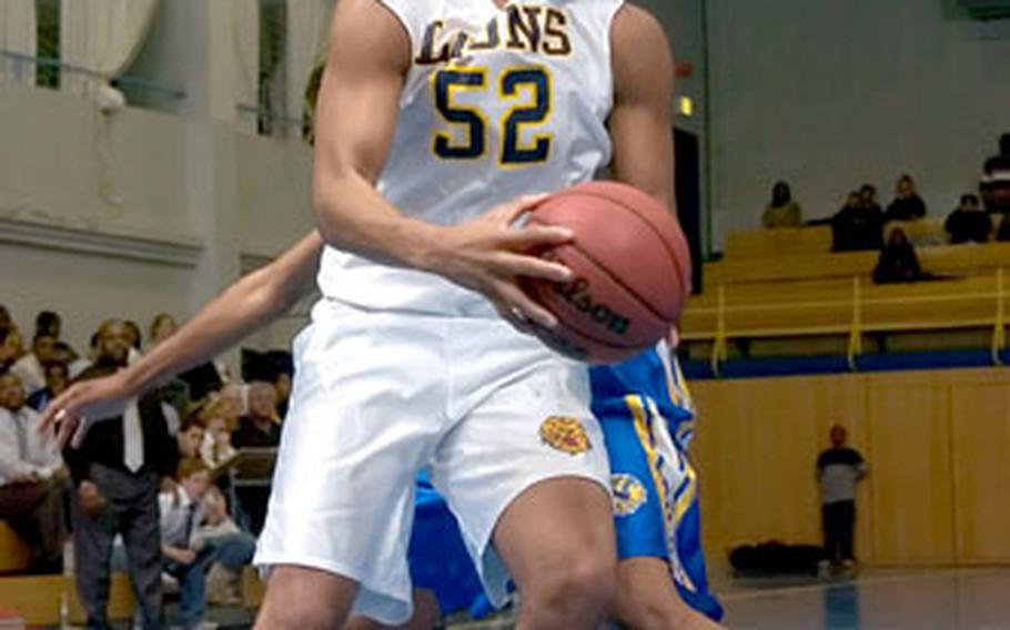 Heidelberg’s Damon Fleming goes strong to the hoop against Wiesbaden during the teams’ opening game of the DODDS Europe high school basketball season. Heidelberg won, 49-43.