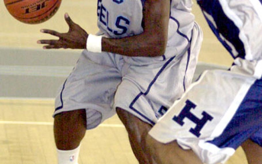 Yongsan guard Ronald Bartley tries to dribble past Kato Chapman of the Camp Hovey Hawks during Monday&#39;s double-elimination playoff game. Bartley is a two-time All-Armed Forces guard who helped lead Team USA to a gold medal in 2004 and a bronze two weeks ago in the SHAPE tournament at Mons, Belgium.