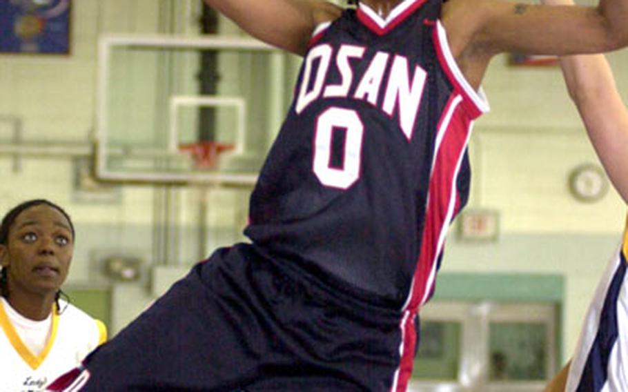 Center A.J. Beard (0) of Osan goes up for a shot against Camp Humphreys during Wednesday&#39;s women&#39;s championship game.