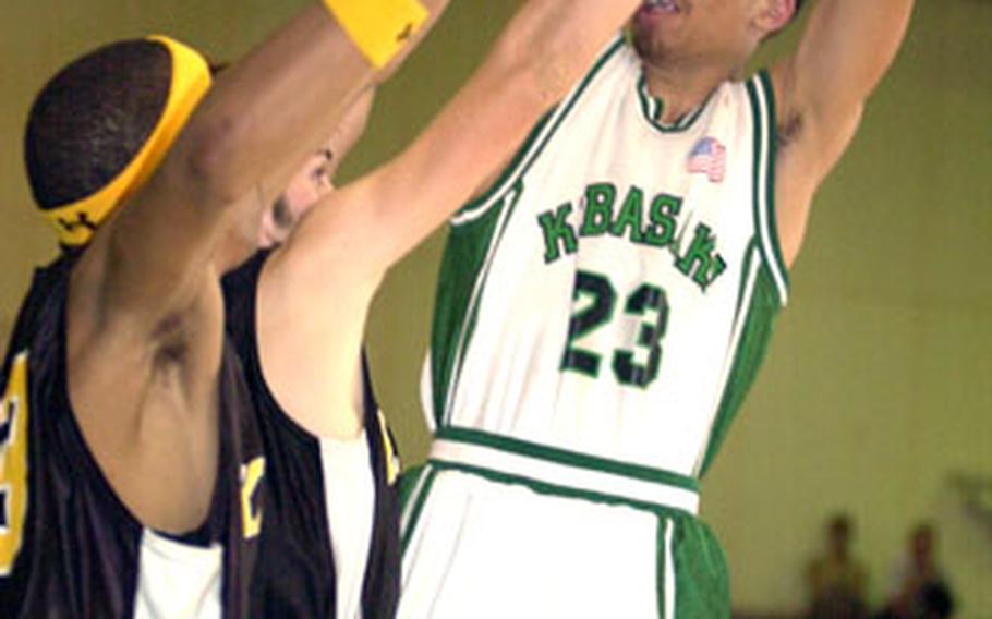 Vance Maxey of the Kubasaki Dragons tries to shoot as Tony Watkins and Alex Mierzejewski of the Kadena Panthers defend during Friday’s game at Kubasaki High School, Camp Foster, Okinawa. Kubasaki won 92-63.