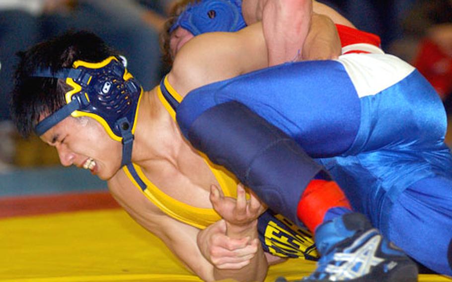 Andrew Moon struggles to free himself from Ramstein’s Noah Sheppard, right, during last year’s 125-pound final, which Sheppard won. Moon is wrestling again at 125 and is looking forward to another shot at the title during the European championships next month — and another shot at Ramstein on Saturday.