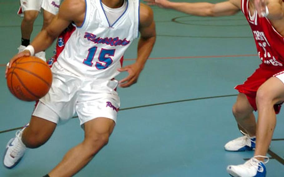 Ramstein’s Whitney McCloud dribbles around Lakenheath’s Keith Johnson in Ramstein, Germany, on Saturday. McCloud scored 17 points as Ramstein won 61-21 in a game halted in third quarter.