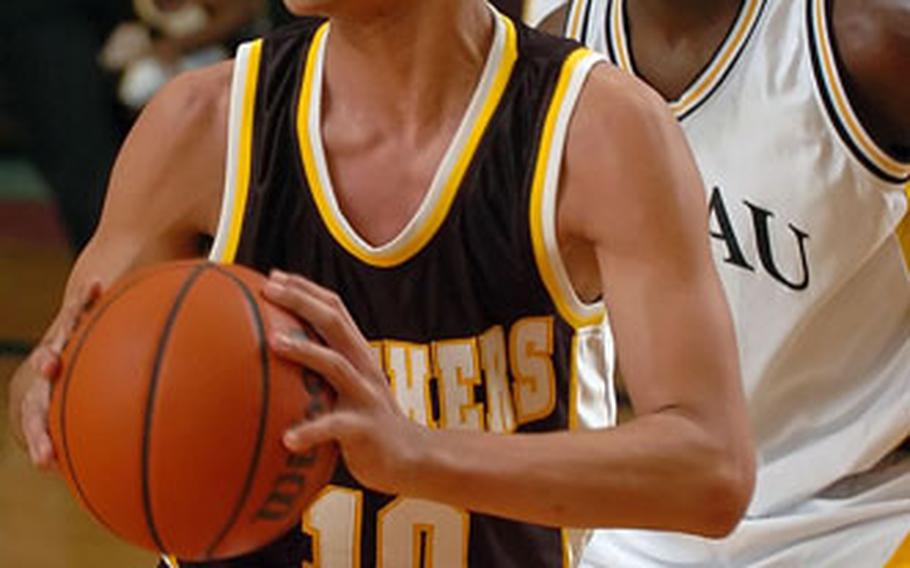 Patch’s Rafael Polanco looks for an outlet pass as Hanau’s Perry Cannie applies defensive pressure Friday night.