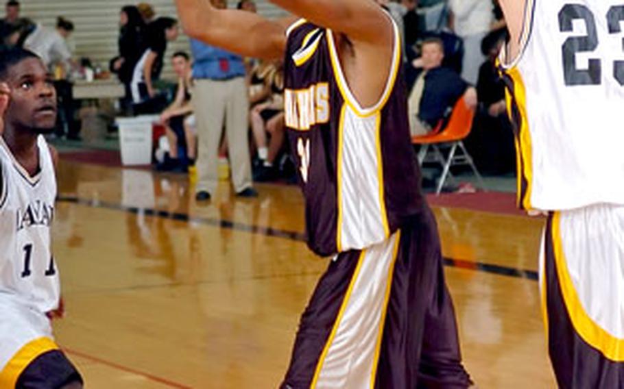 Patch’s Archie Barnes puts up a shot between Hanau’s Perry Cannie, left, and Ivan James, Friday night.