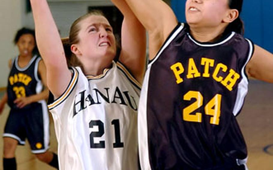 Hanau’s Emily Morris tries to shoot over Patch’s Jennifer Ocenar Friday night.