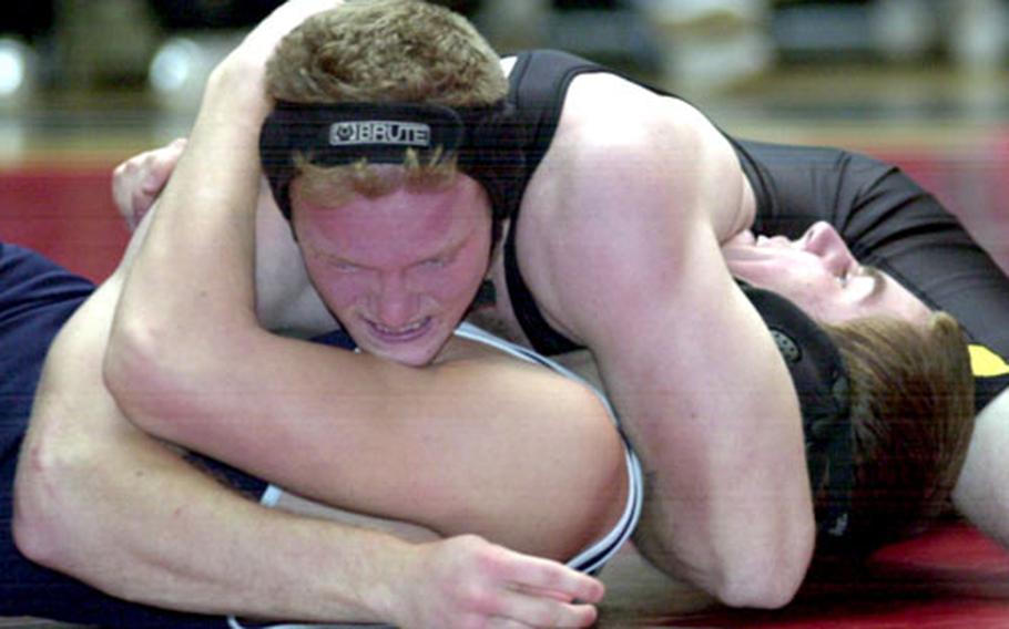 Brandon Stout of Kadena glues the shoulders of Seoul American&#39;s Clark Campbell to the mat during Thursday&#39;s 168-pound round-robin bout. Stout pinned Campbell in 1 minute, 34 seconds.