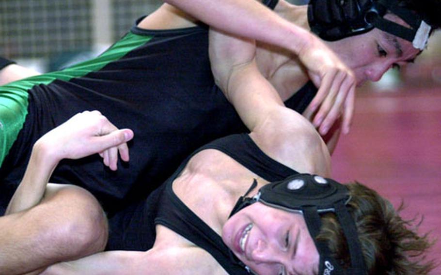 Scott Wood of Kubasaki gets the upper hand on Kevin Donahue of E.J. King during the 101-pound gold-medal bout. Wood decisioned Donahue 2-0.