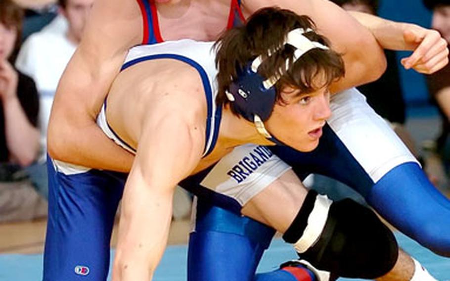 Ramstein’s Ryan Gough takes down Brussels’ Steve Cote during the 130-pound championship match. Gough pinned Cote at 3:43 to win the title.