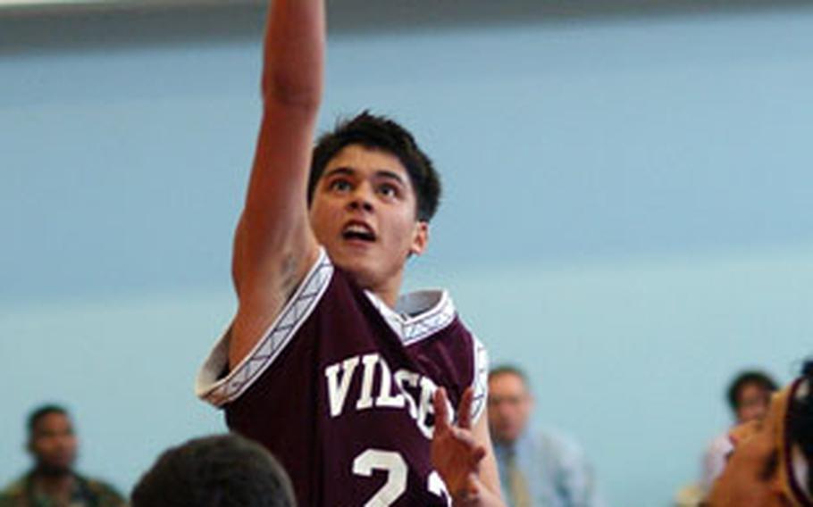 Vilseck’s Michael Klein shot over Andrew Watson of Naples on the first day of the 2006 European Division II basketball championships in Mannheim, Germany. Ninth-seeded Vilseck beat No. 3 Naples, 59-31.