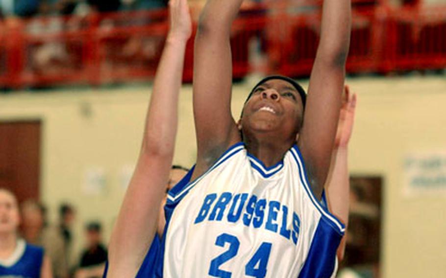 Reliesha Burns of Brussels gets off a shot in front of an Incirlik defender.