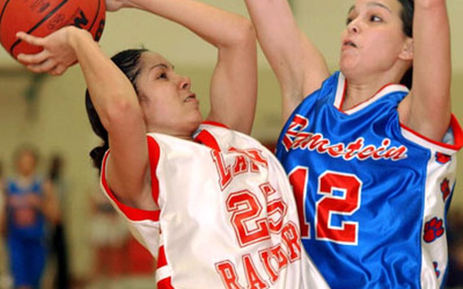 Kaiserslautern's Anisha Ingram tries to get a shot off over Ramstein's Lisa Domingo in Friday night's final of the 2006 DODDS-Europe girls Division I basketball championships at Mannheim, Germany. Kaiserslautern won, 45-20.