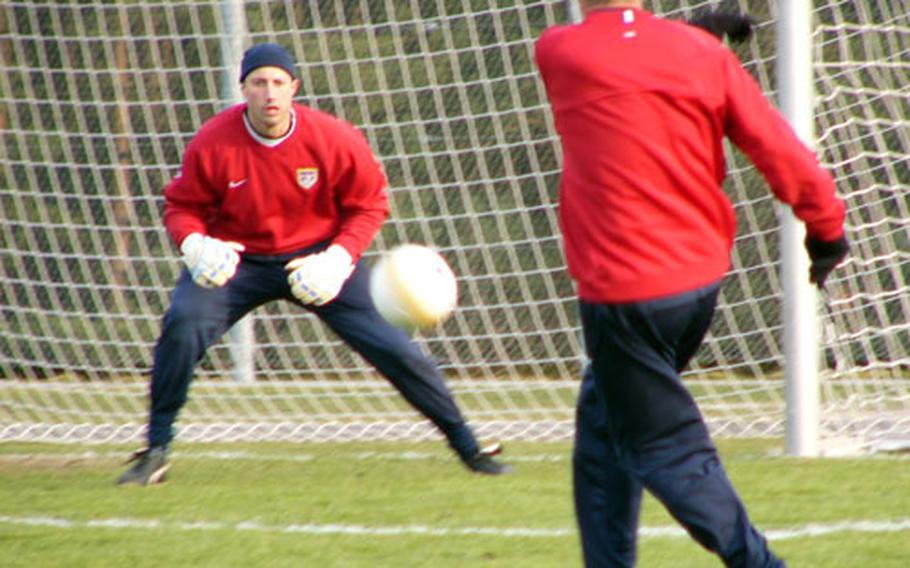 U.S. goalkeeper coach Milutin Soskic (foreground), a member of the Yugoslavia&#39;s World Cup team in 1958 and Olympic team in 1960, warms up Kasey Keller prior to a scrimmage Monday in Eselsfürth, Germany. Keller, who mans the nets for Borussia Mönchengladbach of the German first division, and his U.S.teammates were preparing for Wednesday night&#39;s game against the Polish national team in Kaiserslatuern&#39;s Fritz Walter Stadium.