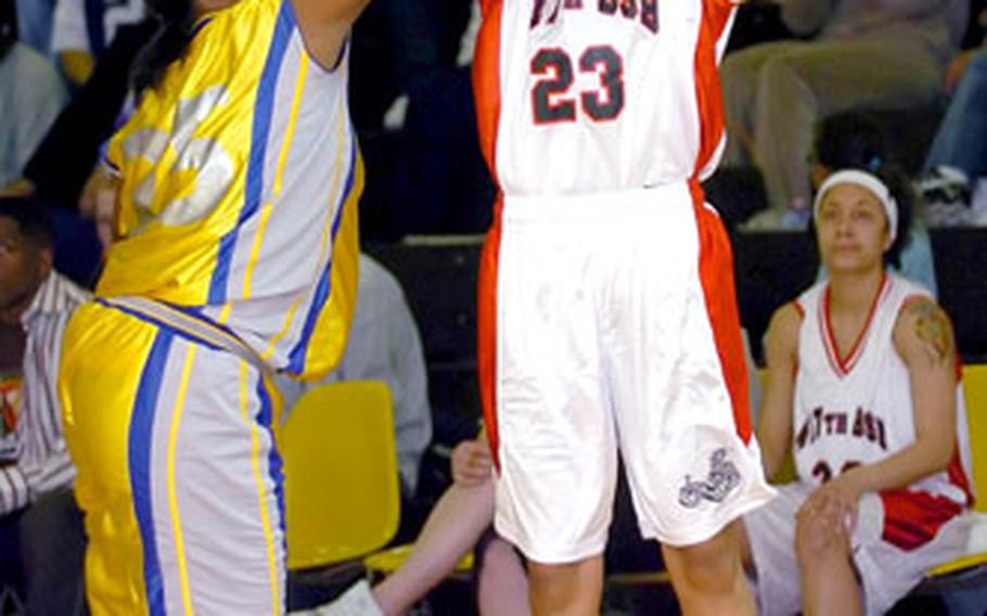 Kitzingen’s Amber Wallace shoots over Wiesbaden’s Tamika Dickens on Sunday. Kitzingen won 65-49 to force a second game in the double-elimination tournament, but Wiesbaden won the title.