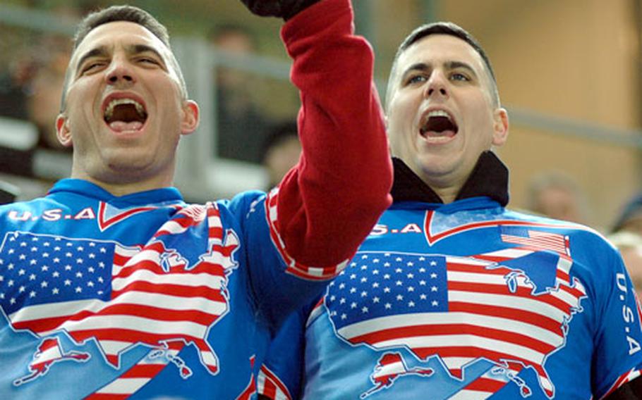 Two U.S. fans show their support for the American squad during Wednesday night&#39;s game against Germany in Dortmund.