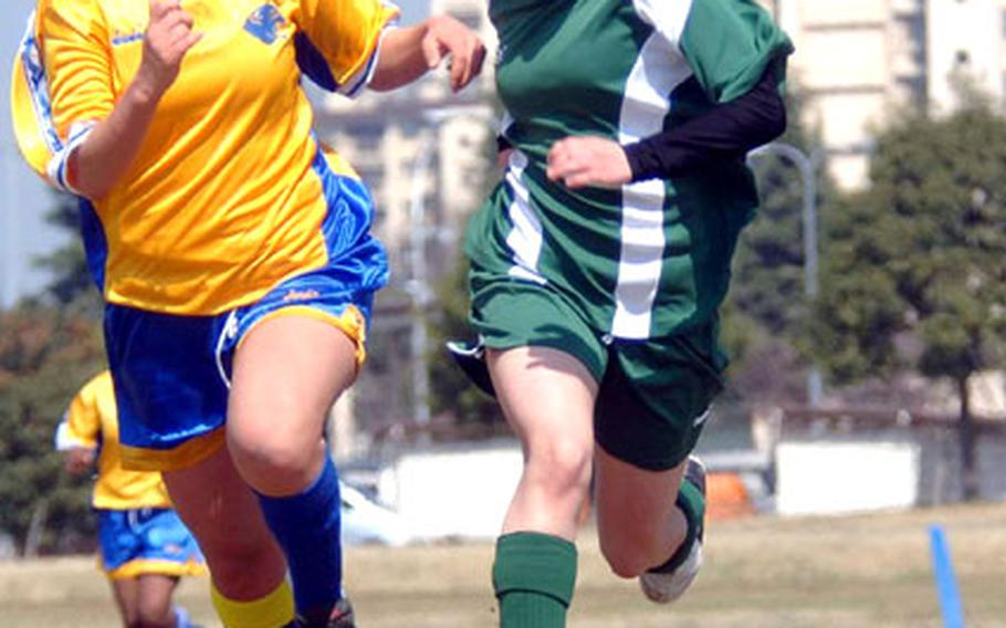 Mia Angelella, right, of the Robert D. Edgren Eagles battles Sarah Vosti of the Yokota Panthers for the ball during Saturday’s JSL match at Yokota Air Base, Japan. Edgren won 4-0 and improved to 5-1-1, the best start in school history.