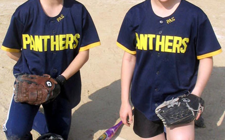 Pusan American senior catcher/pitcher Jeni Smith and her sister, freshman pitcher/catcher Ashley Smith. The Panthers have only eight players, and must borrow a player from their opponents.