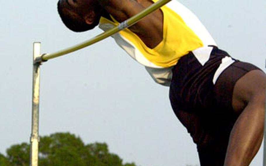 Kadena Panthers senior Marquis Newton competes in the high jump during Friday’s Okinawa Activities Council track and field meet. Newton came in second with a leap of 6 feet.