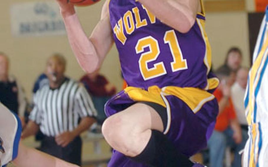 Würzburg’s Jonathan Ortiz drives to the basket against Wiesbaden in the DODDS-Europe boys Division I championship game. Ortiz, who averaged 10.4 points a game, was one of two Würzburg players chosen for the 2006 All-Europe first team.