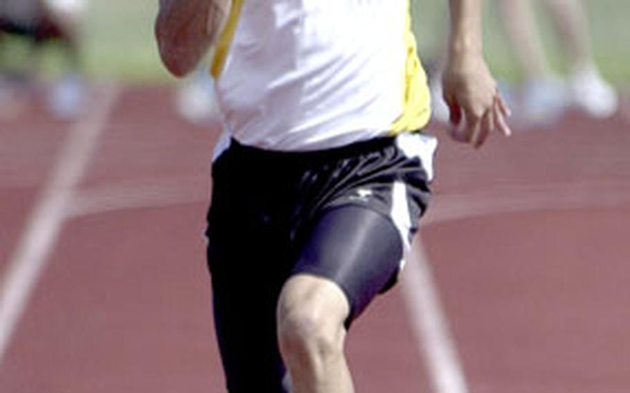 Kadena junior Jeff Morton competes in the 100-meter dash on Saturday. Morton won with a time of 11.22 seconds.