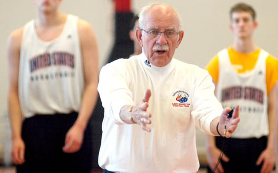 Dick McCann, veteran coach of the American Albert Schweitzer Tournament team, gives his players instructions during practice Tuesday.