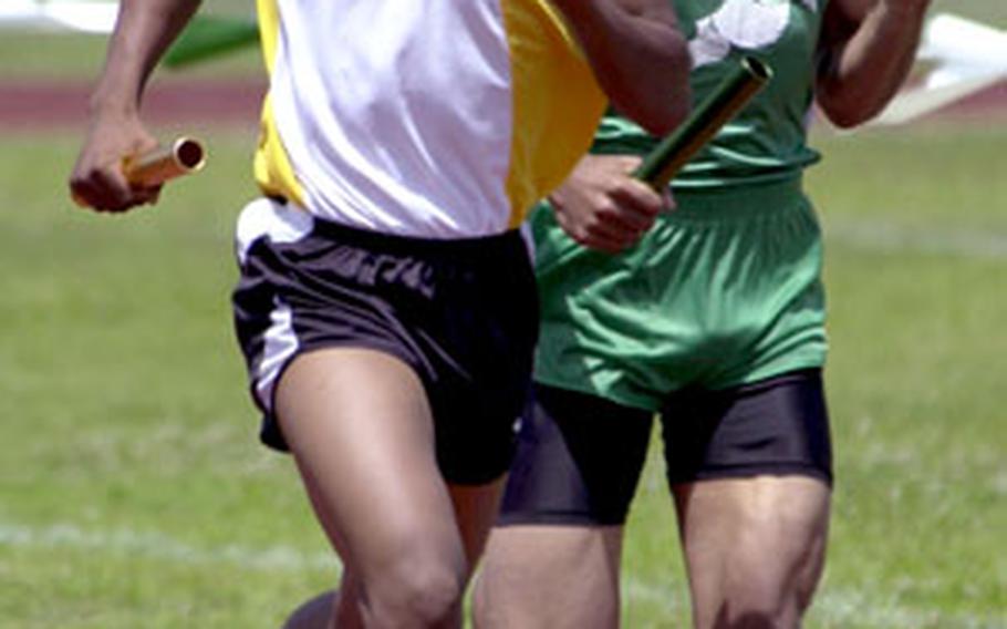 Kadena junior Manuel Duran and Kubasaki senior Steven Thompson chug for the finish line in the 1,600 relay in the Petty Memorial track meet. That event is the closest thing to a Far East meet the sport has.