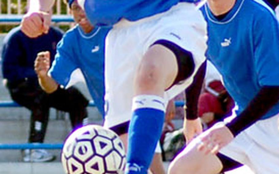 Tom Gass of the Yokota Panthers dribbles the ball during Friday’s Japan Soccer League boys game against Matthew C. Perry at Yokota Air Base, Japan. Yokota won 8-1.