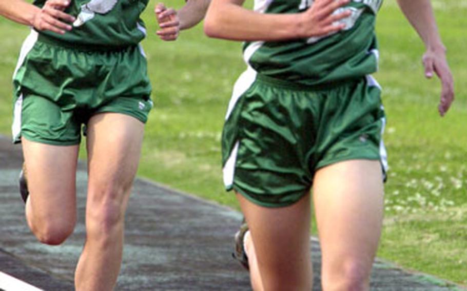 Senior twins Beth and Lisa Nielsen, Kubasaki High School’s long-distance running tandem.