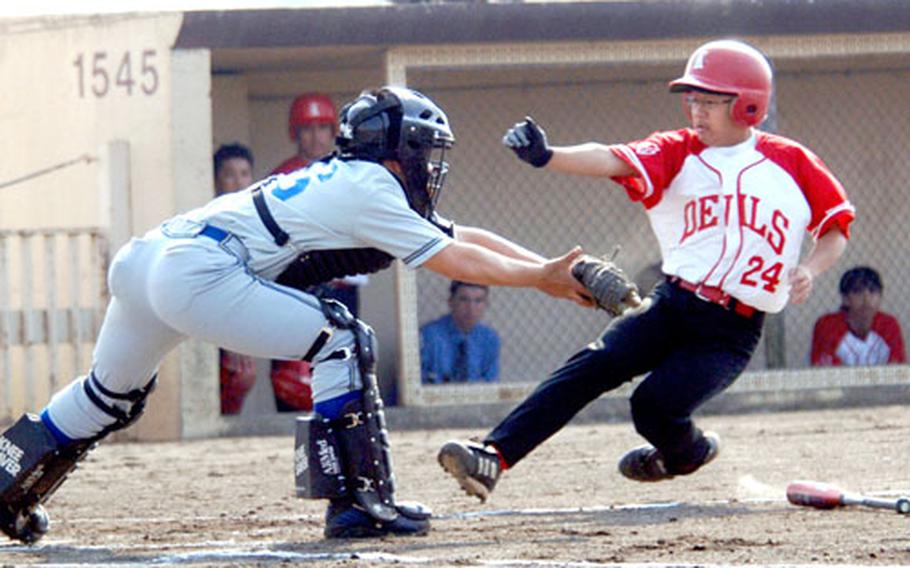 Yokota Panthers catcher Kyle Shimabukuro tags out Alexis Sun of Nile C. Kinnick during Friday’s doubleheader at Yokota Air Base, Japan. The Panthers beat the Red Devils 17-7 in the opener.